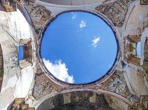 A stunning view of the sky through the ruins of a historic cathedral in Antigua Guatemala.