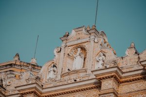 Exquisite baroque facade of La Merced Church, showcasing elaborate sculptures in Antigua, Guatemala.